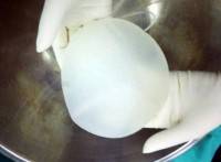 Textured surface of breast implants
